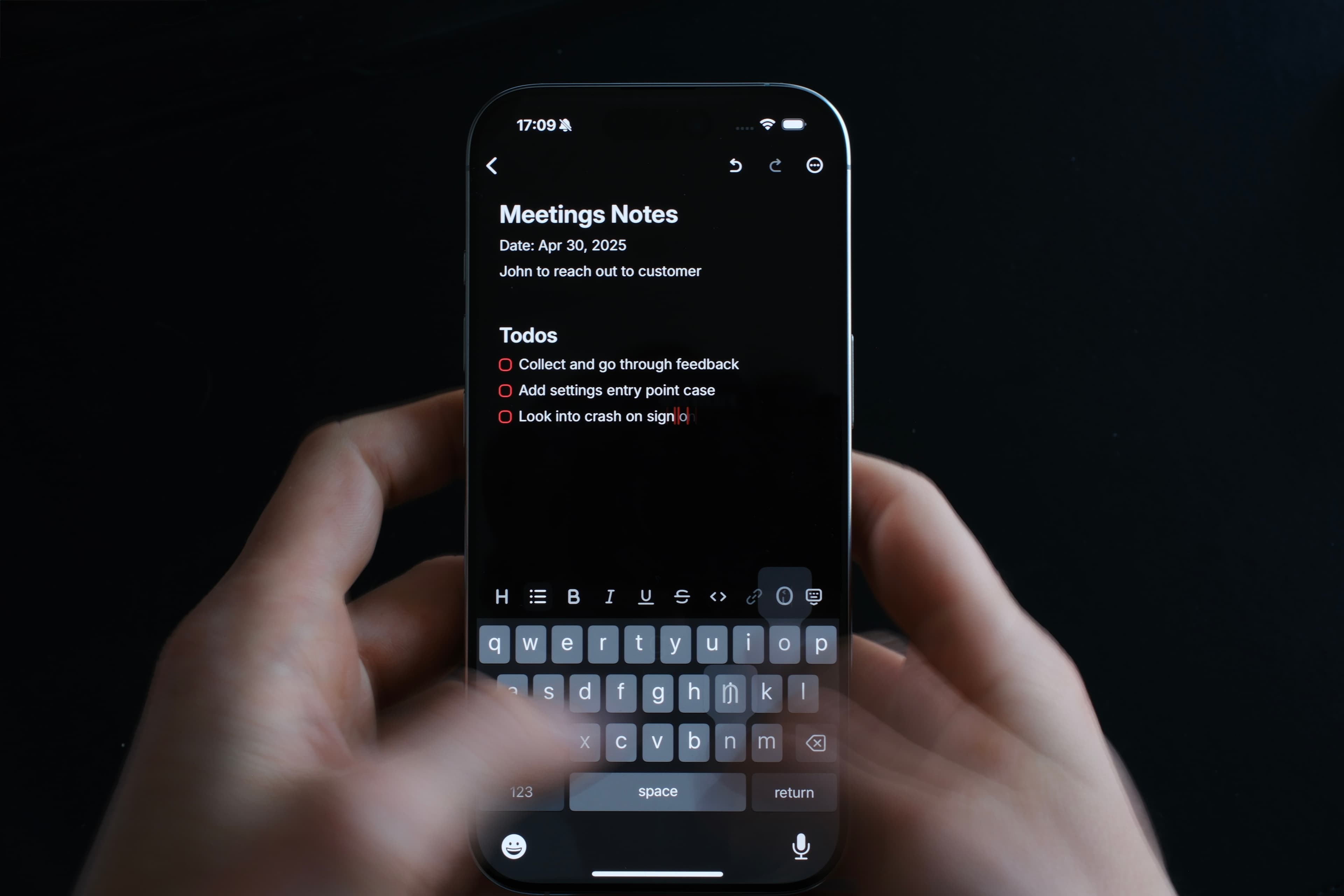 An image of someone typing a note in Raycast on an iPhone