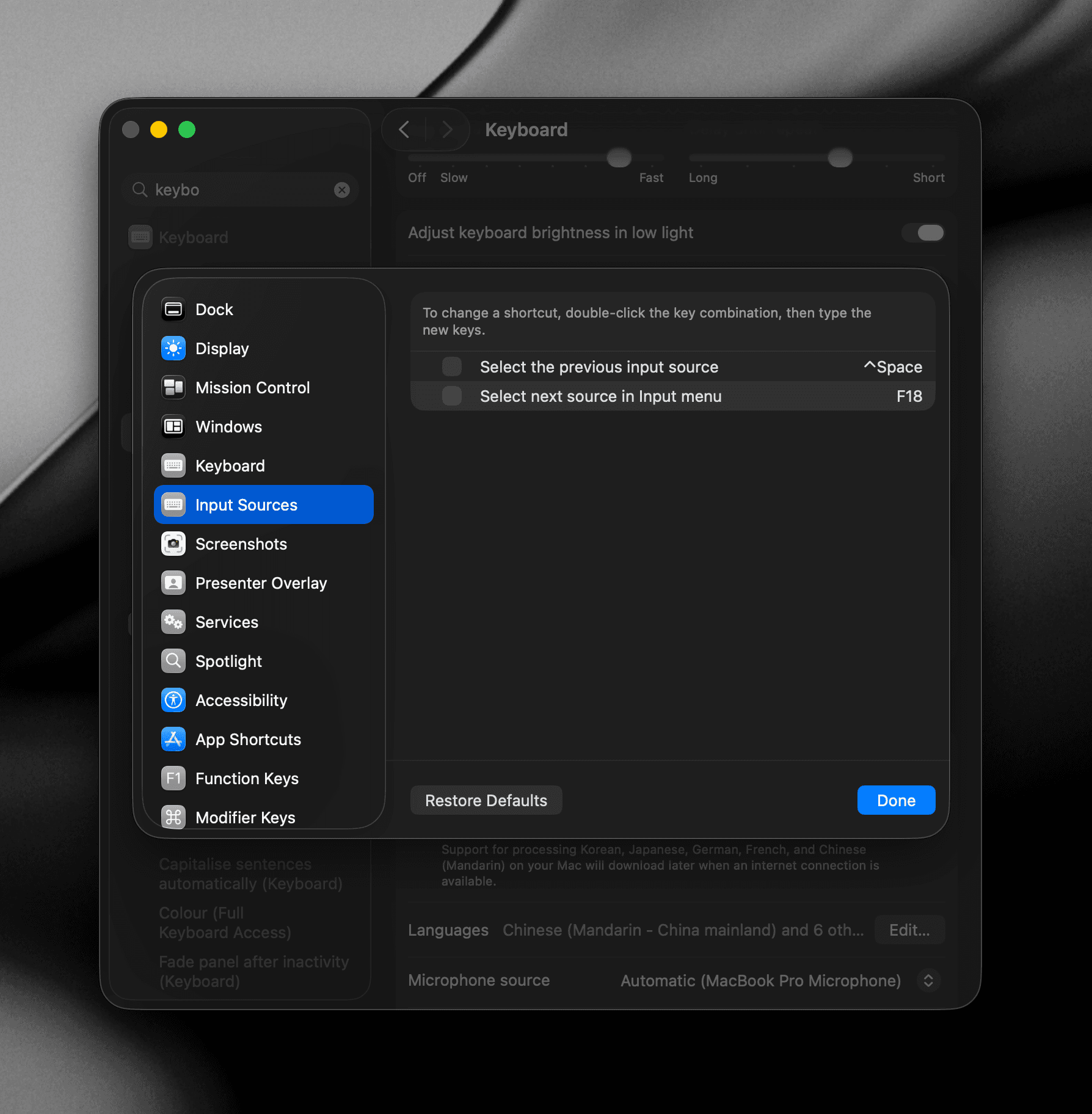 Screenshot of System Settings showing the Input Sources keyboard shortcut being changed